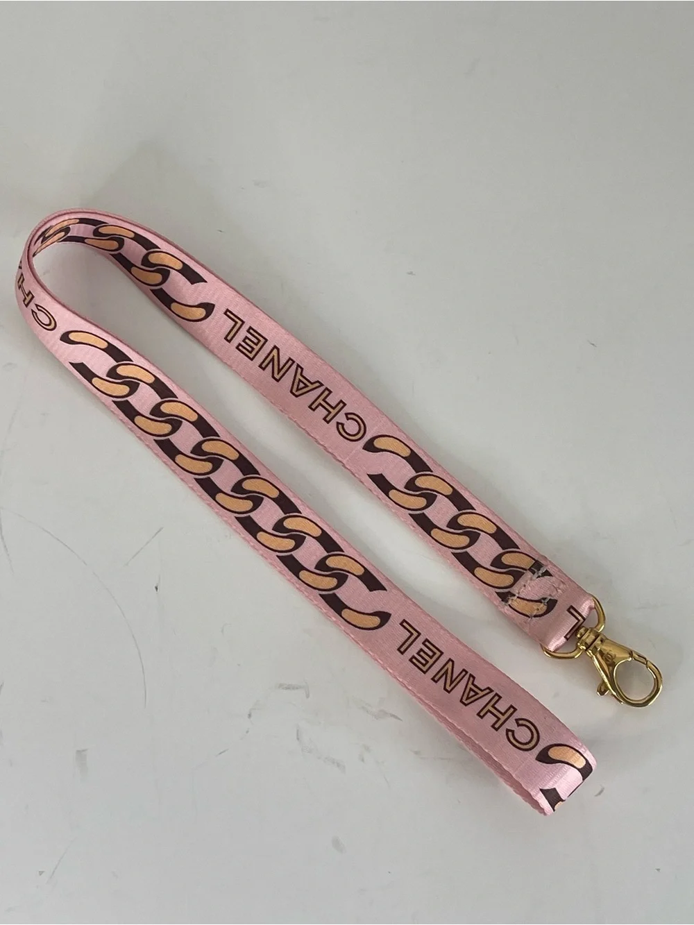 CHANEL Pink Chain-Print Lanyard with Gold Hardware